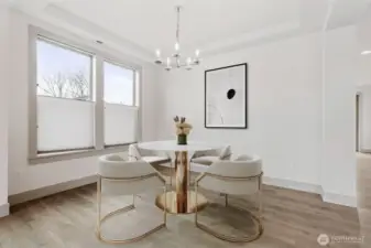 Dedicated dining area, recessed ceiling and plenty of natural light from nearby windows