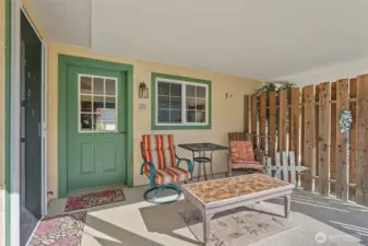 Cute enclosed patio at rear of home...