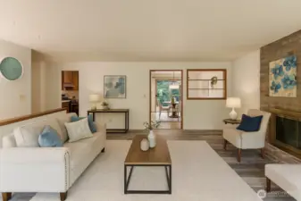 Virtual staged spacious living room with new LVP flooring