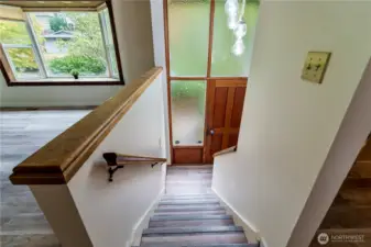 Stairs and entry way with new matching LVP flooring