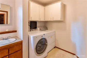 Downstairs laundry room shared with 3/4 bath