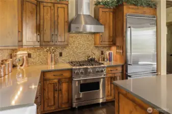 The kitchen is outfitted with a full suite of Viking Professional Series stainless steel appliances, bringing commercial-grade performance and style to the heart of the home.