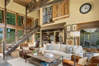 The upper level boasts a bonus room with a barn door (which you can see here) offering the flexibility to stay open to the space below or provide privacy when closed.