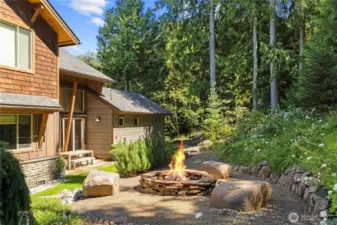 Perfect for entertaining, the cozy backyard firepit brings friends and family together.