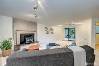 Downstairs Family Room Is Large And Open. Tiled Fireplace & New Carpet.