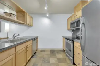 Entertainer’s kitchen! Stainless steel appliances & open layout.