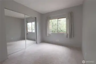 Large and bright bedroom #2. Some paint and newer flooring is all this bedroom needs.