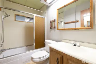 Main Full Bathroom. Nice sized vanity and tub area....just needs a bit of updating.