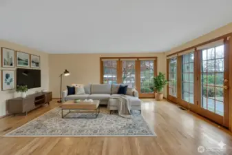 The family room showcases beautiful floor to ceiling windows.