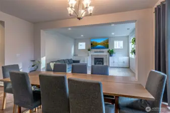 Dining flows between kitchen and living room, perfect for hosting!