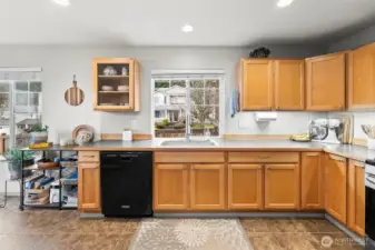 Under cabinet lighting and multiple windows create a bright kitchen that’s a joy to work in.