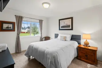 Bedroom 2 with views of the small park across the street.