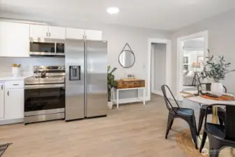 Brand new stainless steel appliances, including an exterior-vented microwave for enhanced air quality. Photos from earlier listing in 2025.