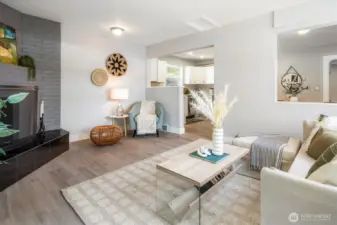 Private family room anchored by a classic fireplace effortlessly connects kitchen to courtyard. Photos from earlier listing in 2025.