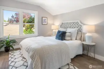 Primary bedroom offers calm and ease with an ensuite bath, walk-in, and discreet storage. Photos from earlier listing in 2025.