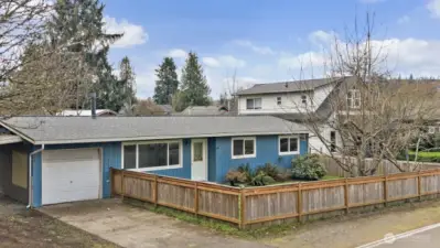Three bed/one bath rambler with one car garage, attached carport.