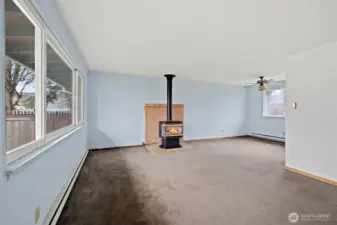 The free-standing stove fireplace brings coziness on chilly, PNW evenings.