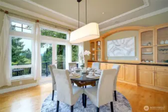 Exceptional formal dining area. Enjoy entertaining with room for 12-14 dinner guests, the space is grand. Sips outside on the adjacent, sunlit balcony. Peek-a-boo Eastside views, built-in shelving for all your entertaining.