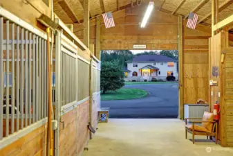Gorgeous view of the Craftsman style home from inside the barn.
