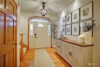 Gorgeous entryway with soaring ceilings and grand staircase.