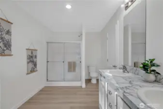 primary bath with large walk-in closet