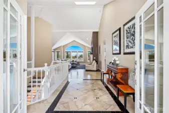 Grand entry through double doors boasts Peruvian travertine floors.