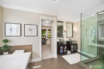 Five-piece primary bathroom leads to a fabulous walk-in closet.