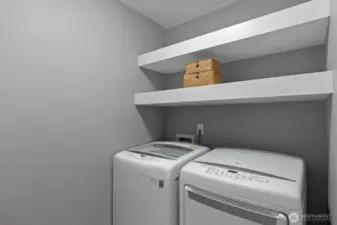 Upstairs laundry room with plenty of storage