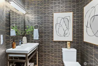 Main floor powder with elegant wall paper and fixtures