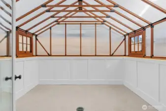 Light and bright interior sunroom or greenhouse - an inviting space to relax, grow, or create year-round.