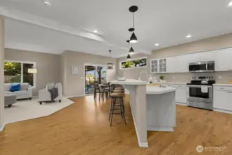 Open layout flows to the dining area and family room, ideal for gatherings.