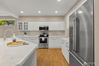 Recently refreshed kitchen with white cabinetry, stainless steel appliances, and plenty of counter space.