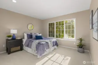 Three additional bedrooms upstairs, each bright and inviting.