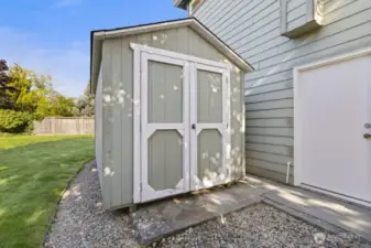 Storage shed included for tools and equipment.