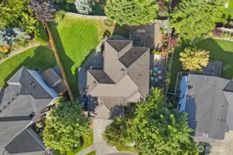 Bird’s-eye view highlighting the home’s generous lot, landscaped backyard, and outdoor living spaces.