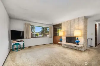 Large living room with wood burning fireplace