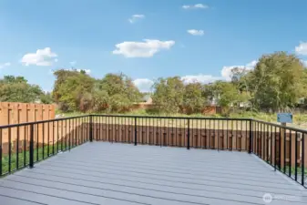 Composite Desk off back of home & full yard fencing.