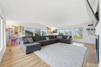 Living room w/ vaulted ceilings