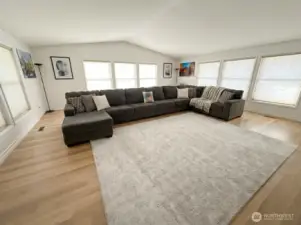 Living room w/ vaulted ceilings