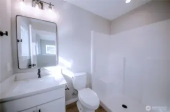 Primary bath with step in shower.