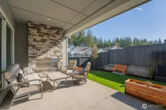 Relax on the patio featuring a gas fireplace and convenient BBQ hookup.