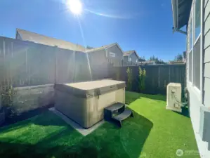 Relax in the hot tub and enjoy the easy-care turf—no mowing required.