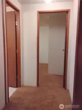 Wide hallway which is well lit.