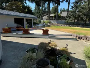 Pond area, patio, storage and terraced raised beds