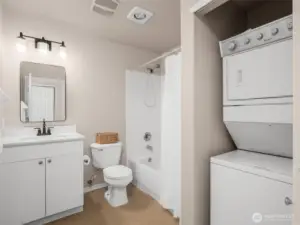 Primary bath with stackable washer and dryer