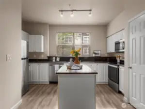 Large kitchen island and updated counters and appliances