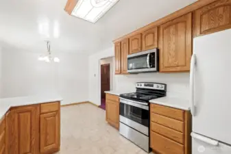 This photo shows the dining room next to the kitchen.