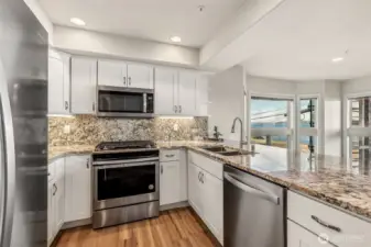 NEW stainless steel appliances, granite  countertops & backsplash, white shaker  cabinets & oooohhhh the view of the water  while you are cooking meals!