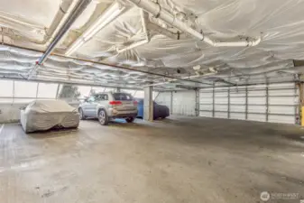 Covered/garage parking- 2 spots. 8A is  located on the main level and second is  located in basement.