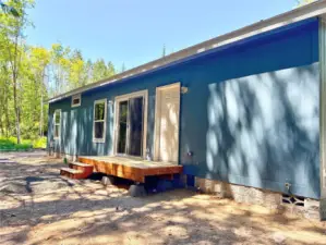 Rear with sliding door and small deck
